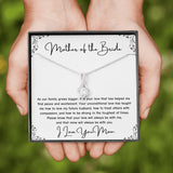 The perfect gift for mom on your wedding day.Ribbon shaped,14K white gold over stainless steel,clear crystals, a sparkling 7mm round Cubic Zirconia. Includes heartfelt message card from daughter to Mother.