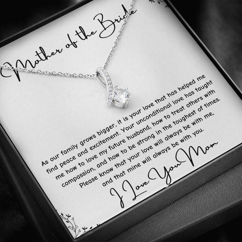 The perfect gift for mom on your wedding day.Ribbon shaped,14K white gold over stainless steel,clear crystals, a sparkling 7mm round Cubic Zirconia. Includes heartfelt message card from daughter to Mother.